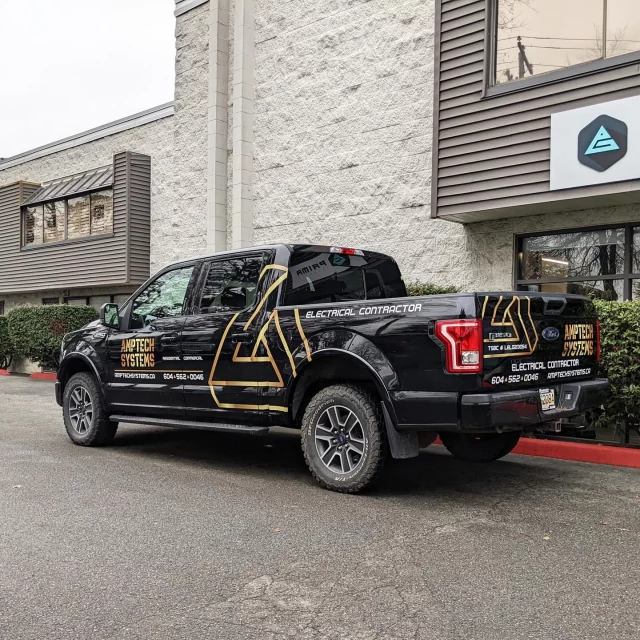 Check out these large decals, filling up the adverting real estate for @amptechsystems! This process is called a print and cut. We first print the logos/contact information with company branding colours. We then run the prints through our digital plotter to cut the complex shapes for the decals. From there, install is a breeze……have a great weekend everyone! 🙌